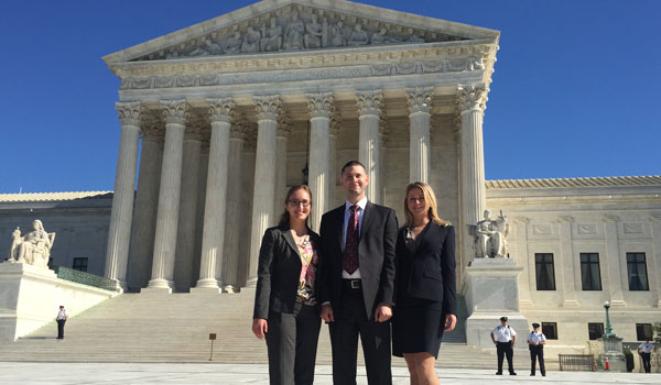 Clinic students pose at Supreme Court building in D.C.