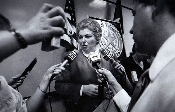 Image of Weddington with reporters