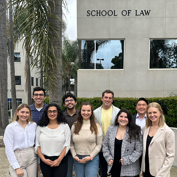 Clinic students in front of the School of Law building